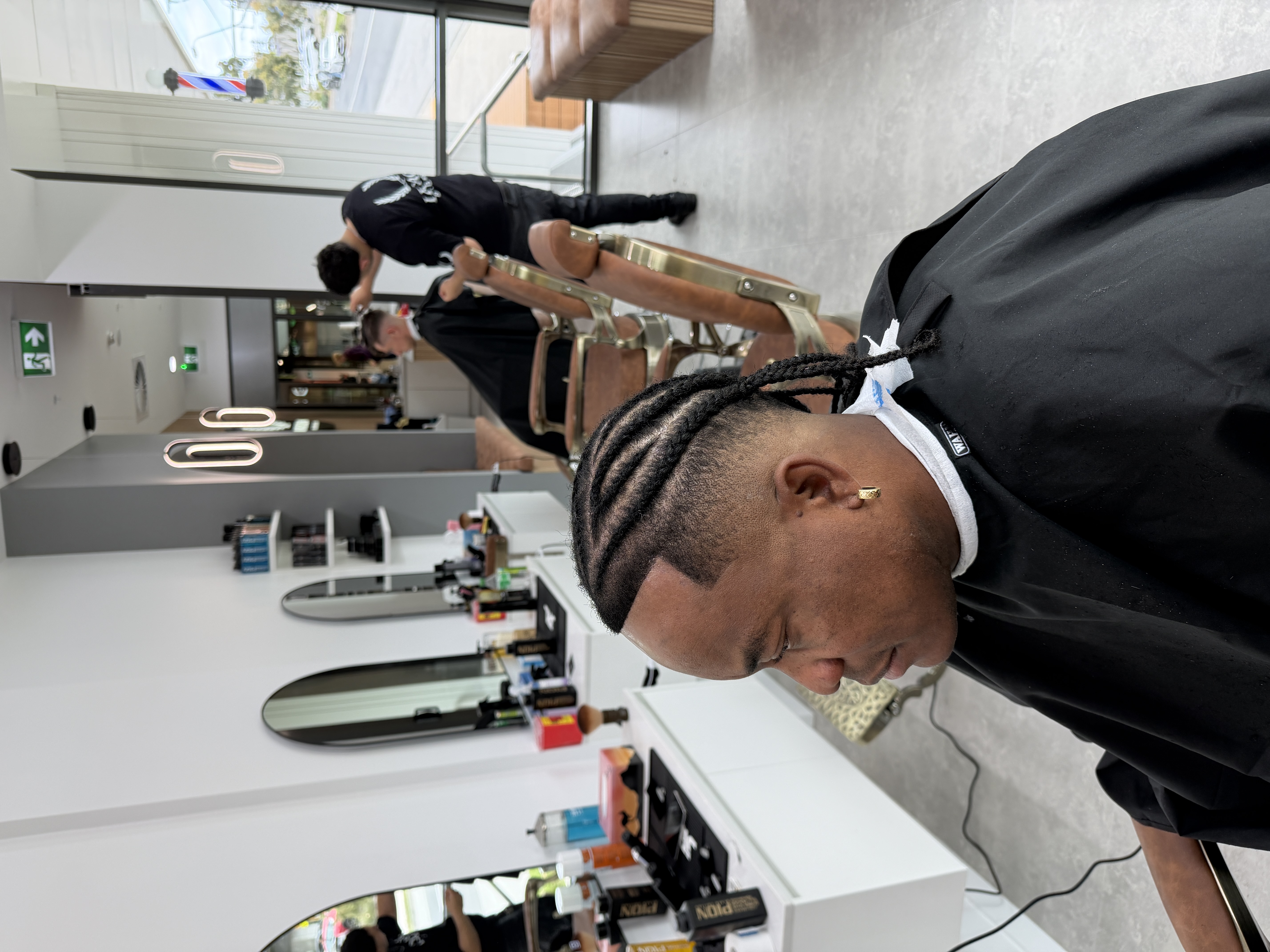 Finished braided hairstyle with a sharp front line-up