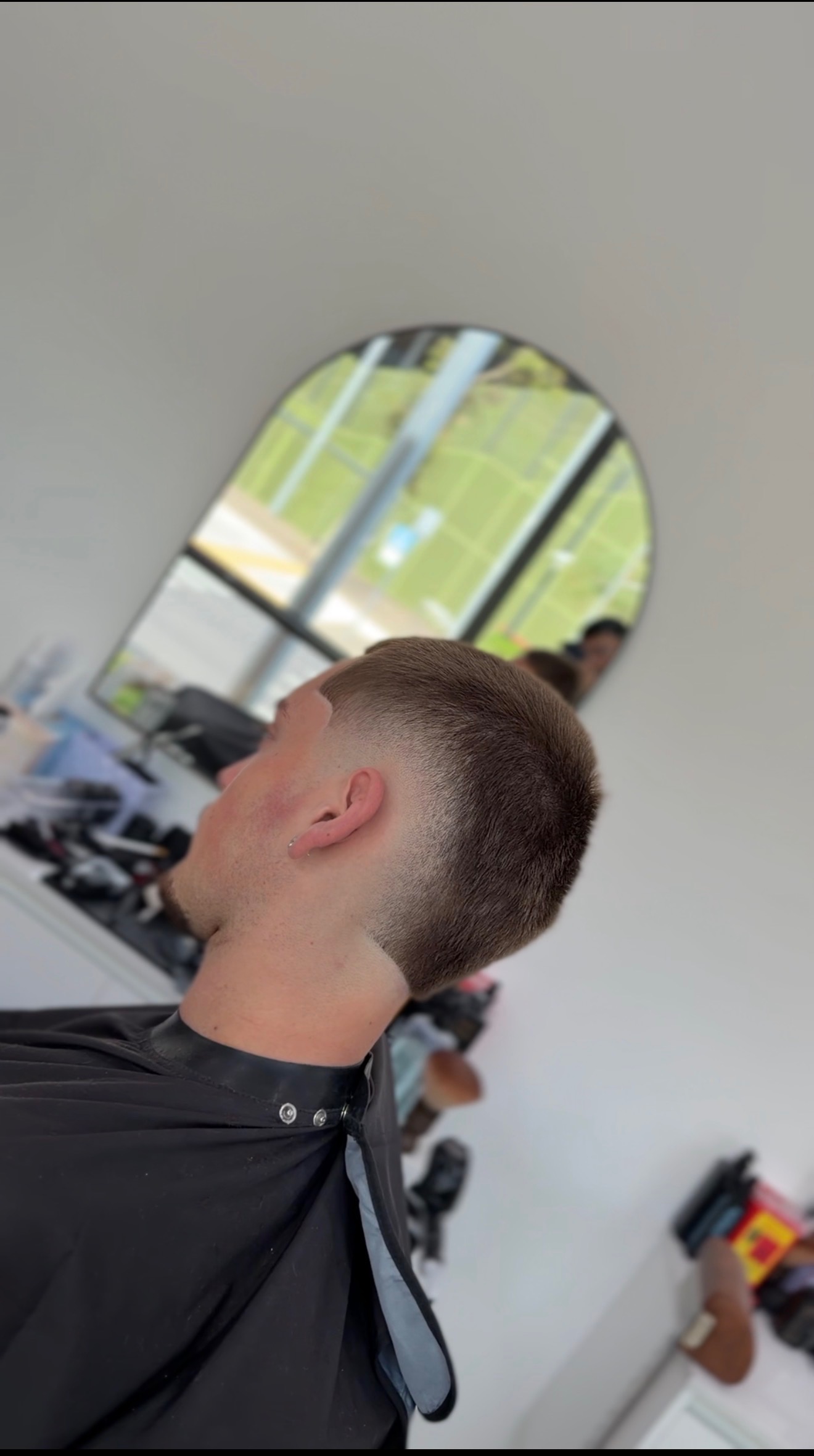 Short textured haircut with a clean faded finish